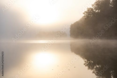 Fotografie misty morning by the lake in Sweden
