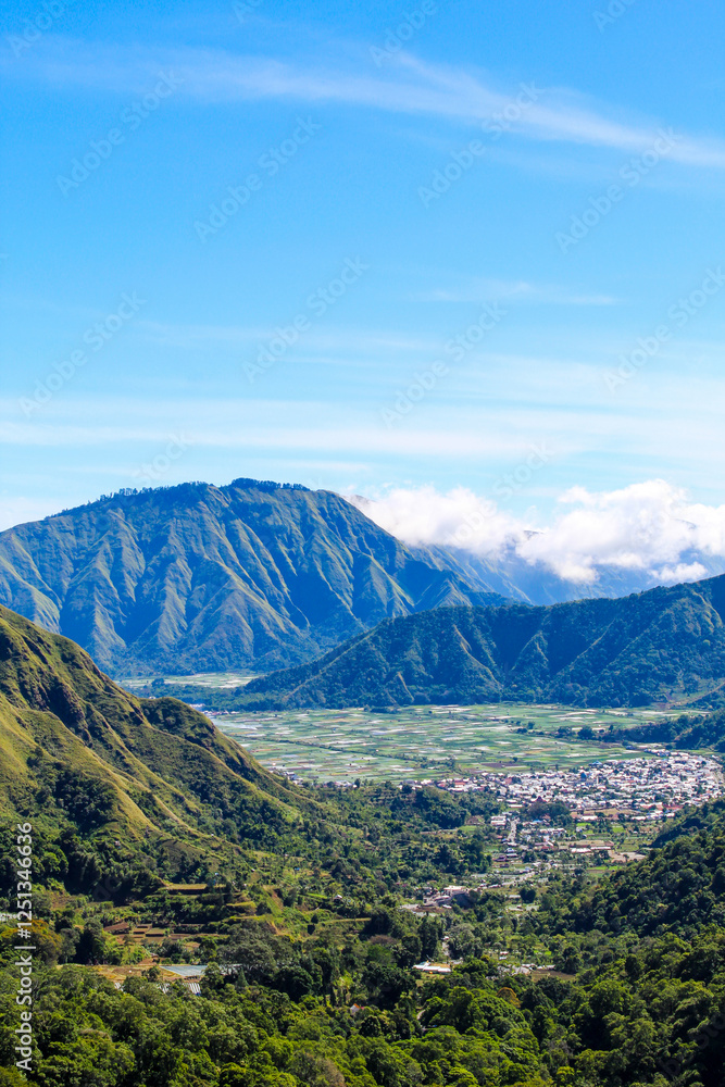 Sembalun Hill, Lombok Indonesia range with a city in the valley below Sembalun Hill, Lombok Indonesia range with a city in the valley below