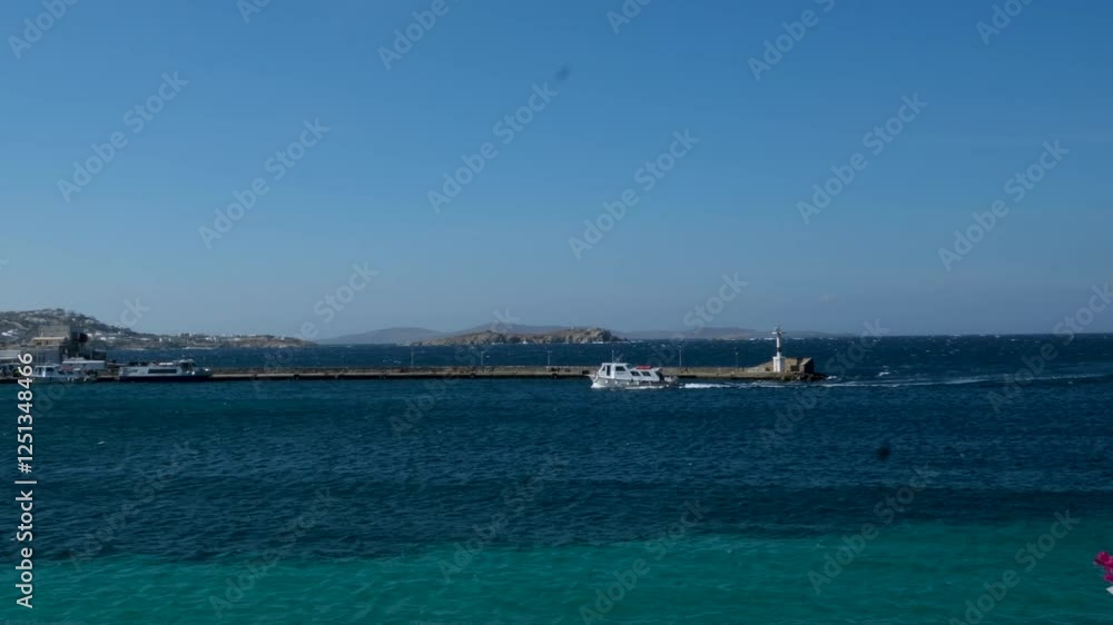 Low-angle sea-level view of small yacht boat sailing in calm open sea at sunset. High quality 4k footage Low-angle sea-level view of small yacht boat sailing in calm open sea at sunset. High quality 4k footage