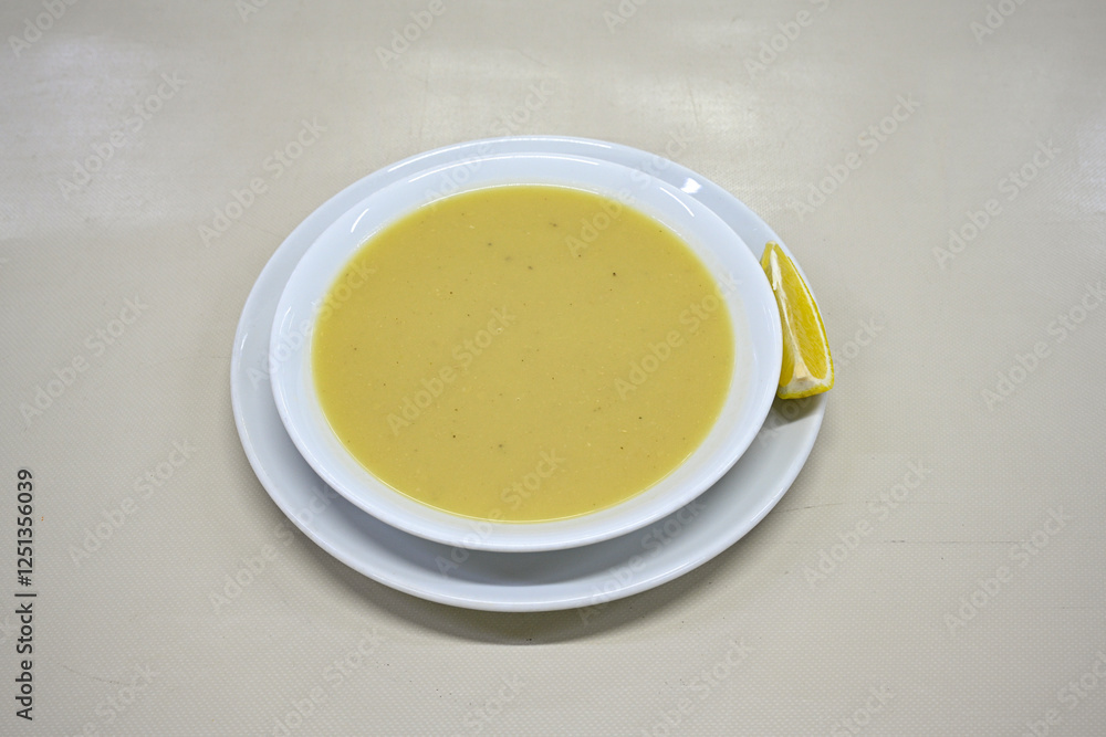 Lentil ( mercimek corbasi ) soup with melted butter and red pepper sauce. Limon ve soslu mercimek corba. Lentil ( mercimek corbasi ) soup with melted butter and red pepper sauce. Limon ve soslu mercimek corba.