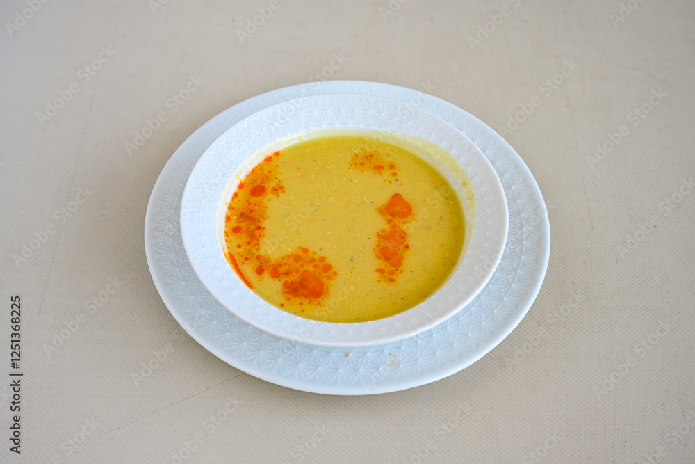 Lentil ( mercimek corbasi ) soup with melted butter and red pepper sauce. Limon ve soslu mercimek corba. Lentil ( mercimek corbasi ) soup with melted butter and red pepper sauce. Limon ve soslu mercimek corba.