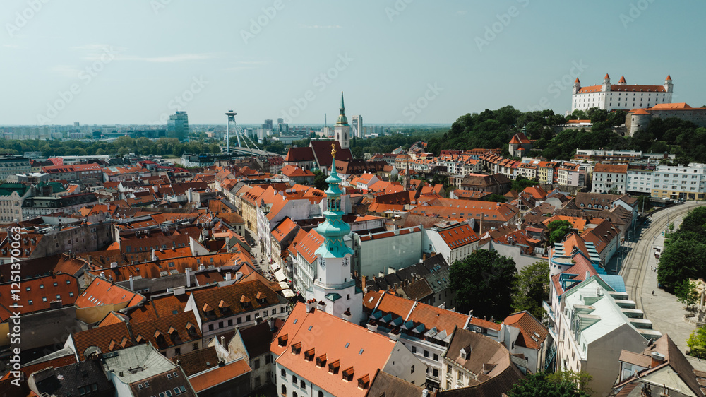 Naklejka premium Bratislava old town view castle and city church in city centre. bratislavy skyline aerial view drone footage of bratislava slovakia city.