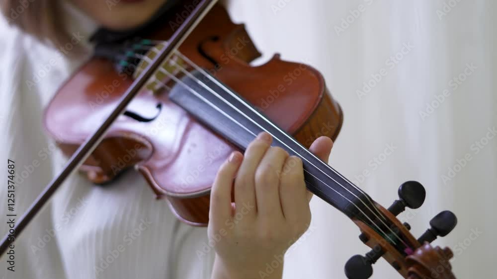Fiddler hand swiftly move bow across violin strings, playing fast. Female musician focus on string technique, fast tempo, musical practice, concert, orchestral rehearsal, refined performance. Close up Fiddler hand swiftly move bow across violin strings, playing fast. Female musician focus on string technique, fast tempo, musical practice, concert, orchestral rehearsal, refined performance. Close up