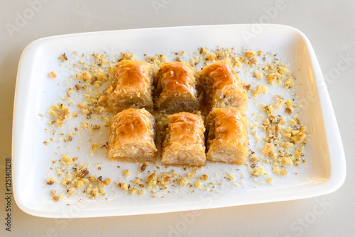 Turkish Dessert Sobiyet, havuc dilimi, midye baklava, mussels baklava and classic baklava with Pistachio . Cikoltali cevizli, fistikli soguk Baklava, top view. photo