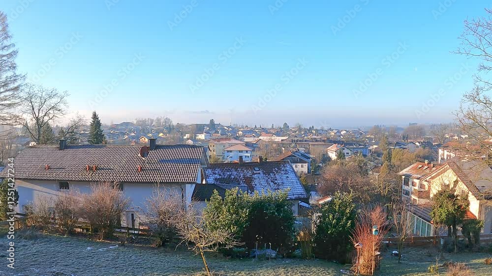 custom made wallpaper toronto digitalA peaceful winter morning in a European town with frost-covered rooftops and a clear blue sky. Traditional houses, misty mountains, and sunlight create a scenic and tranquil atmosphere.