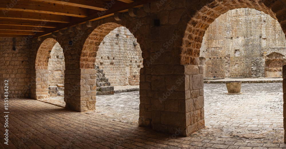 Naklejka premium An old restored fortress. Beautiful stone brick vaults.
