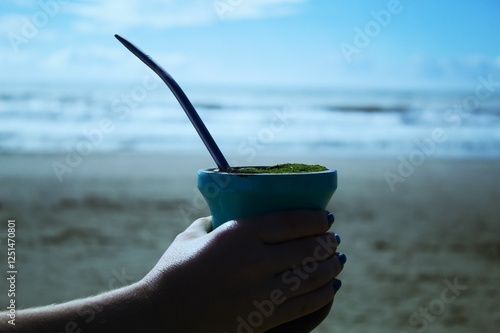 Chimarrão on a beach in Brazil with a sandy bottom and sea water