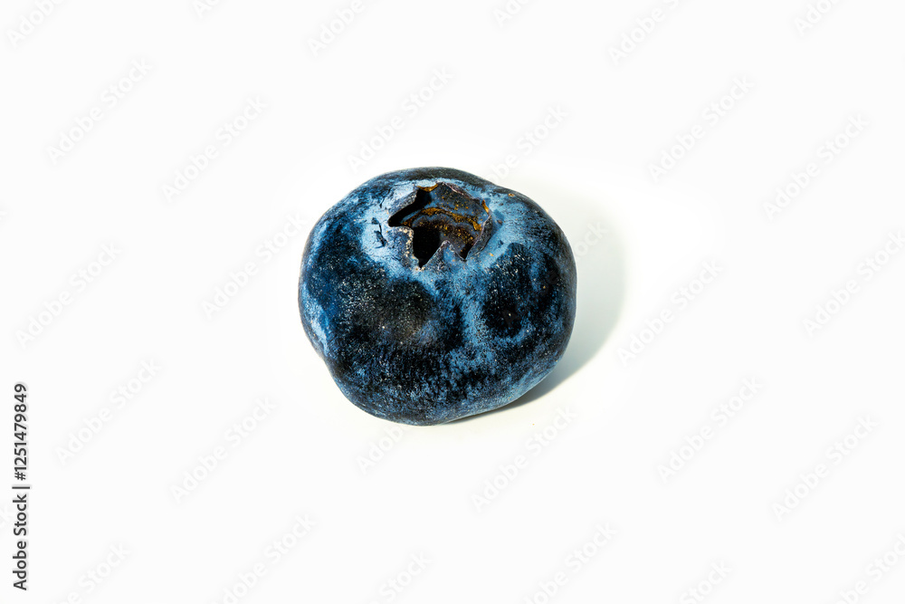 Blueberry with unique texture and markings in bright light Blueberry with unique texture and markings in bright light