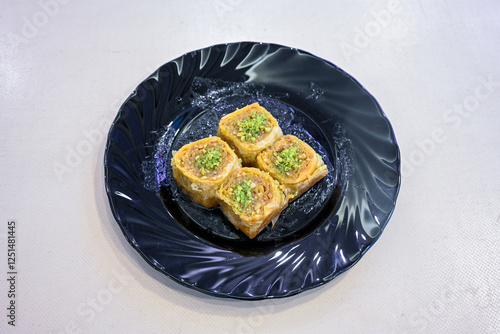 Turkish Dessert Sobiyet, havuc dilimi, midye baklava, mussels baklava and classic baklava with Pistachio . Cikoltali cevizli, fistikli soguk Baklava, top view. photo