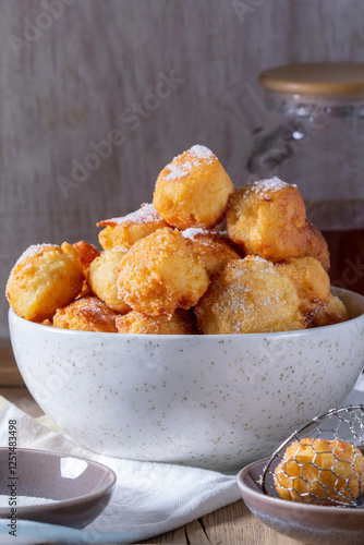 Obraz na płótnie Curd donuts with sugar served with tea or coffee on a light wooden background. Rustic style. w salonie