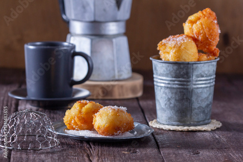 Obraz na płótnie Curd donuts with sugar served with tea or coffee on a light wooden background. Rustic style. w salonie