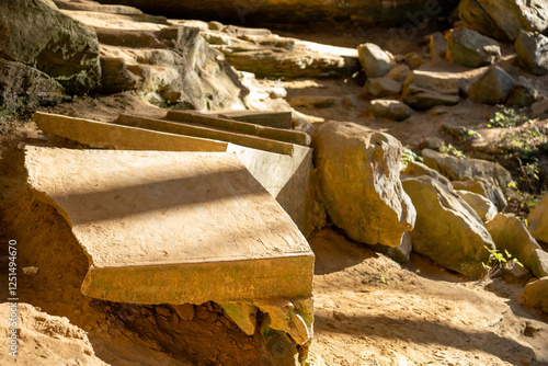 abandoned stone stairs in rocky cave