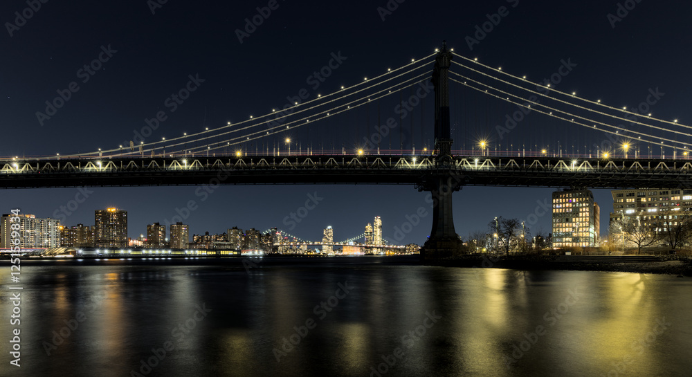 manhattan bridge detail long exposure at night with east river reflections and williamsburg bridge in the background (train passing walkway overpass) dumbo brooklyn travel tourism usa nyc landmark manhattan bridge detail long exposure at night with east river reflections and williamsburg bridge in the background (train passing walkway overpass) dumbo brooklyn travel tourism usa nyc landmark