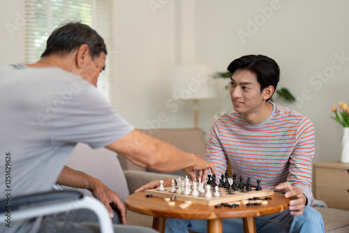 Father and son strategizing during a chess game in a cozy living room, showcasing family connection and engagement. photo