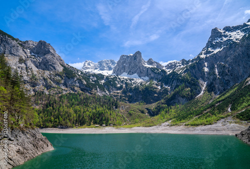 Lake Hinterer Gosausee or Gosau, and Mount Dachstein. Beautiful  landscape with mountains, glacier and green forest in Austrian Alps, Upper Austria, Europe. Sunny day, spring