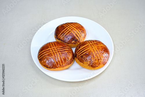 Turkish pastry product , tasty pogaca, acma . Simit, gevrek. Turkish Pastries; peynirli, patatesli, kasarli pogaca, sosili acma, dereotlu pogaca,  borek, acma, ay coregi at patisserie showcase. photo