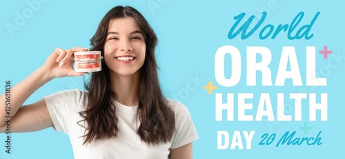 Smiling young woman holding...