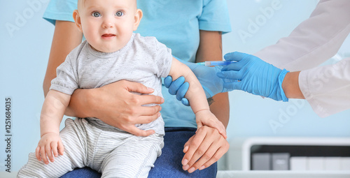 Pediatrician vaccinating li...
