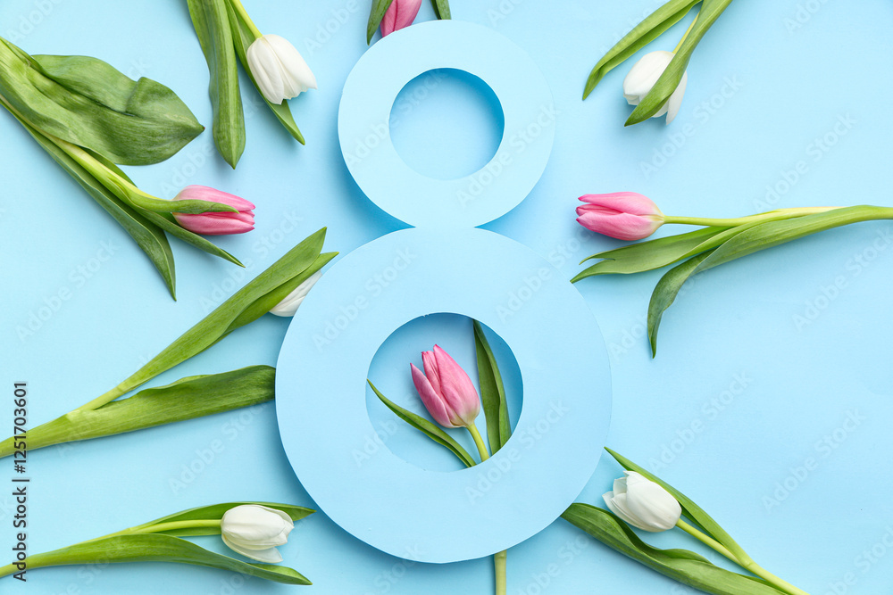 Obraz premium Figure 8 made of paper and beautiful tulips on blue background. International Women's Day