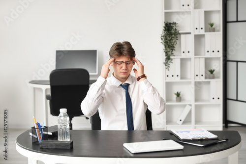 Tired young businessman suf...