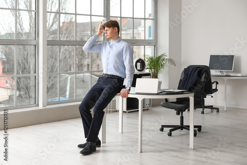 Tired young businessman suf...