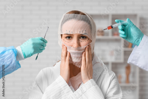 Young woman with bandaged h...