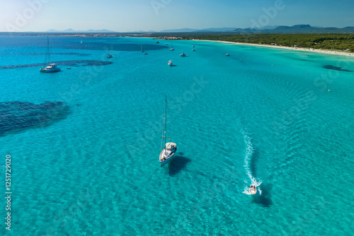 Obraz na płótnie Beautiful sailboats is moored in the incredible turquoise waters of Mallorca w salonie