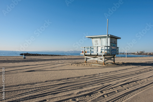 Lifeguard hut/tower in Redondo Beach located in the Torrance district in Los Angeles, California, under a beautiful blue sky