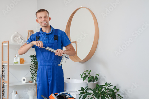 Male plumber fixing sink fa...