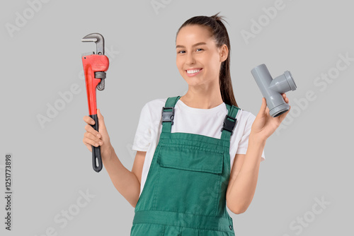 Female plumber with wrench ...