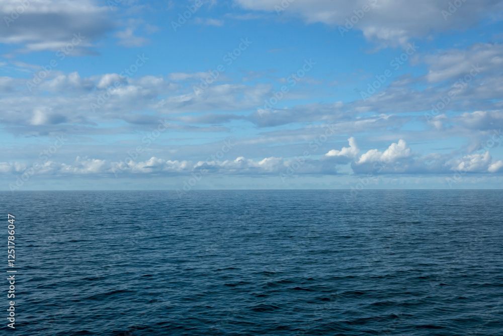 Seascape, white cumulus clouds over the Black Sea, Abkhazia, summer sunny day Seascape, white cumulus clouds over the Black Sea, Abkhazia, summer sunny day