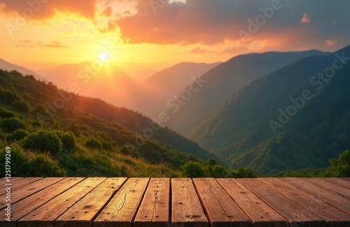 Wooden table terrace overlooks mountain landscape at scenic sunrise. Sun lightens sky with vibrant colors during dawn. Peaceful nature view for travel or vacation background. Copy space. photo