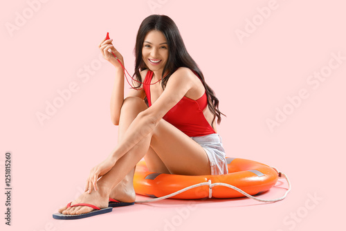 Female beach rescuer with l...