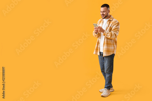Young man with mobile phone...