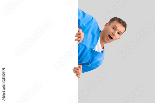 Surprised male doctor with ...