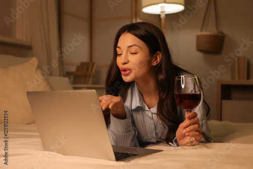 Young woman drinking wine a...