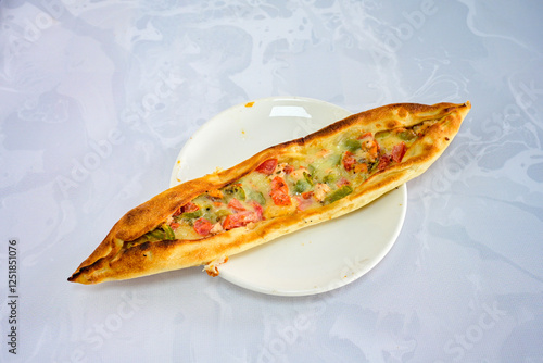 Kiymali pide.Turkish pide with minced meat. Turkish pizza mince pita Pide on white . Etli ekmek.Kusbasi kasarli, kiymali kasarli, kiymali yumurtali, Bafra, Trabzon, Kusbasili pide. Urfa acili lahmacun photo