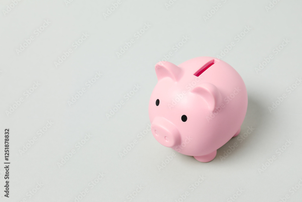 Piggy coin bank on gray background for money savings, financial security or personal funds concept. Piggy coin bank on gray background for money savings, financial security or personal funds concept.