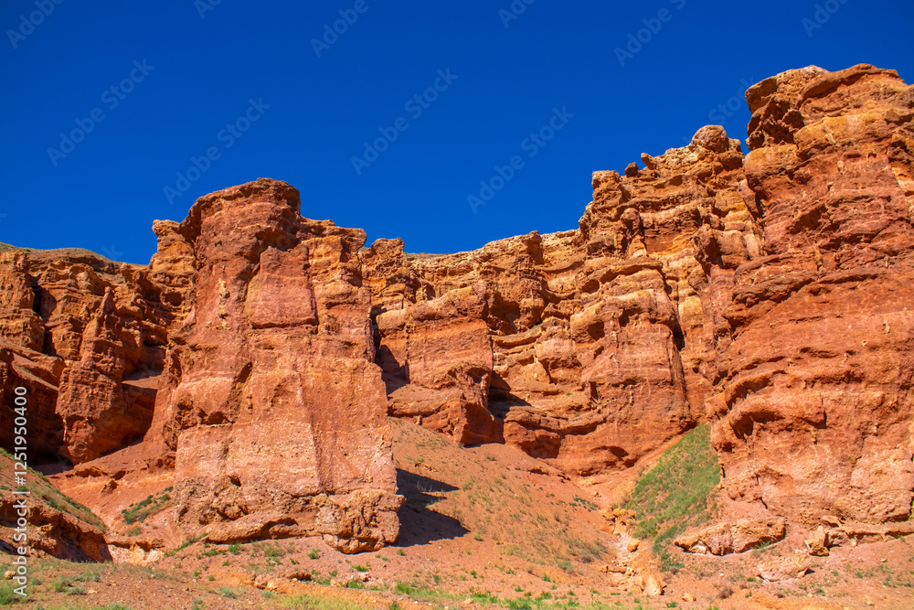 Charyn Canyon, Valley of Castles. The excellence of Kazakhstan. Panorama of natural unusual landscape. The red canyon of extraordinary beauty looks like a Martian landscape. Charyn Canyon, Valley of Castles. The excellence of Kazakhstan. Panorama of natural unusual landscape. The red canyon of extraordinary beauty looks like a Martian landscape.