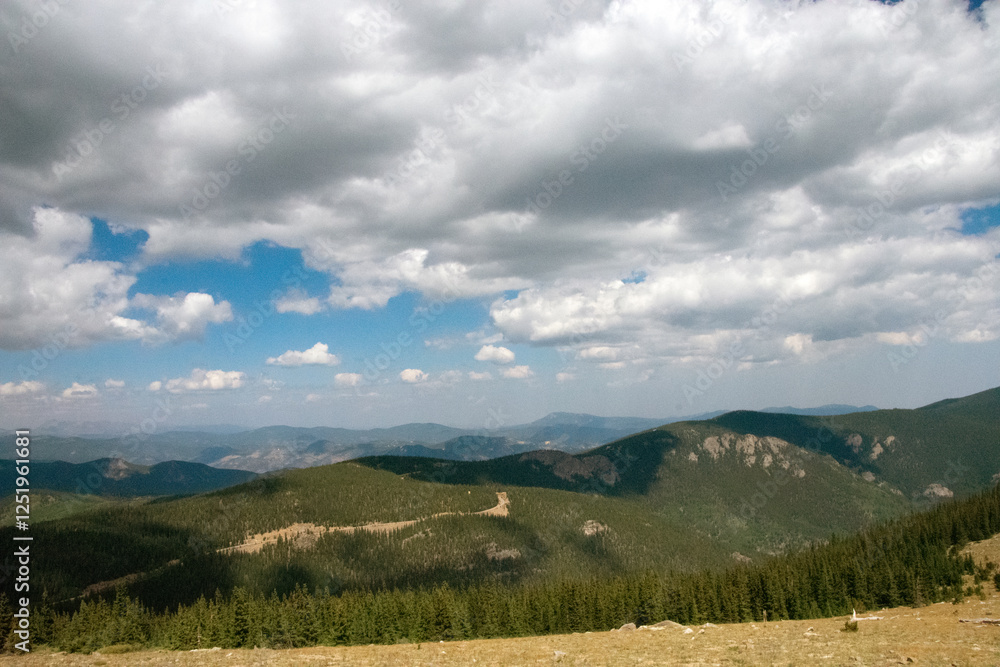 Fototapeta premium Clouds rising over the Mountains From Mt. Blue Sky 