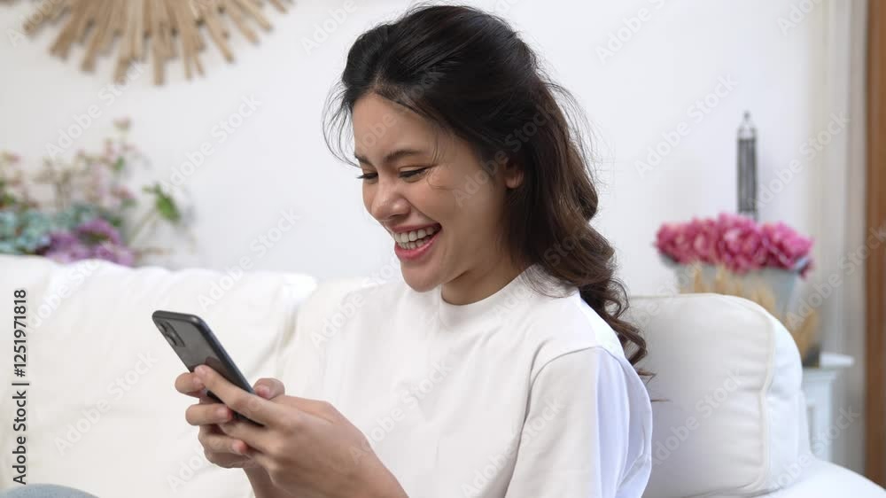 Young woman using smartphone browsing for online shopping E commerce by online payment gateway at vivancy home. Modern and convenience online purchasing make secure and convenient purchases.