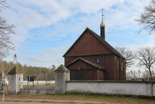 Wooden church from the 17th century dedicated to Saints Peter and Paul the Apostles in Zakrzewo Koscielne in Poland. photo