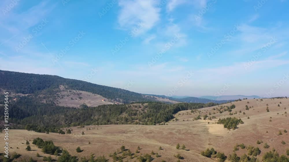 A drone's view of gentle, rolling hills. A drone's view of gentle, rolling hills.