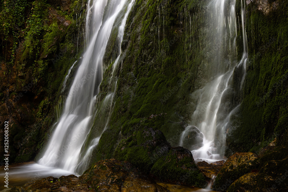 Obraz premium Cascades of Koleshino Falls in Belasica Mountains, Novo Selo, Republic of North Macedonia. The size of the waterfall is 15 meters