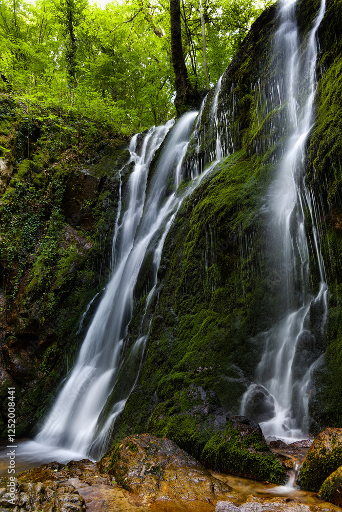 Naklejka premium Cascades of Koleshino Falls in Belasica Mountains, Novo Selo, Republic of North Macedonia. The size of the waterfall is 15 meters