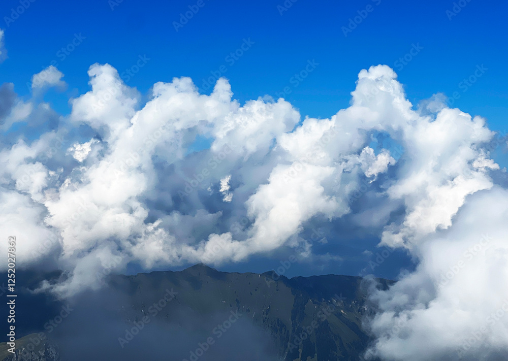Beautiful photogenic clouds over the Uri Alps massif in the Swiss Alps, Melchtal - Canton of Obwalden, Switzerland (Kanton Obwald, Schweiz) Beautiful photogenic clouds over the Uri Alps massif in the Swiss Alps, Melchtal - Canton of Obwalden, Switzerland (Kanton Obwald, Schweiz)