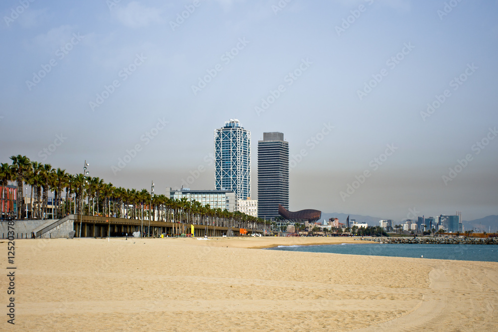 barcelona beach at sunset with buildings barcelona beach at sunset with buildings