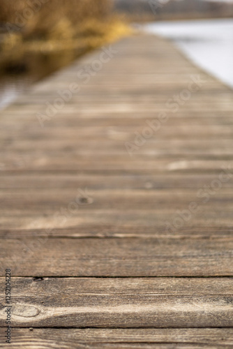 Wooden decking over the water goes into the distance.