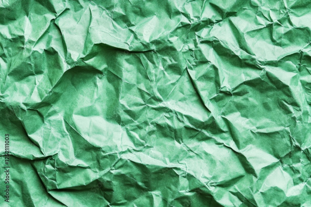 Fototapeta premium Green crumpled paper macro close-up abstract texture. AI generated