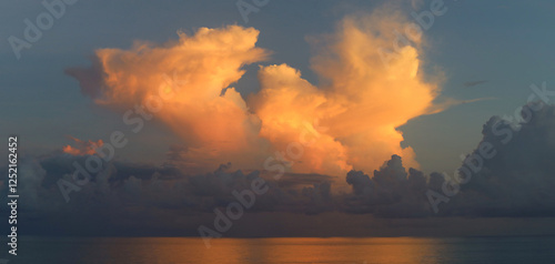 Beautifully illuminated clouds of Caribbean sunrise